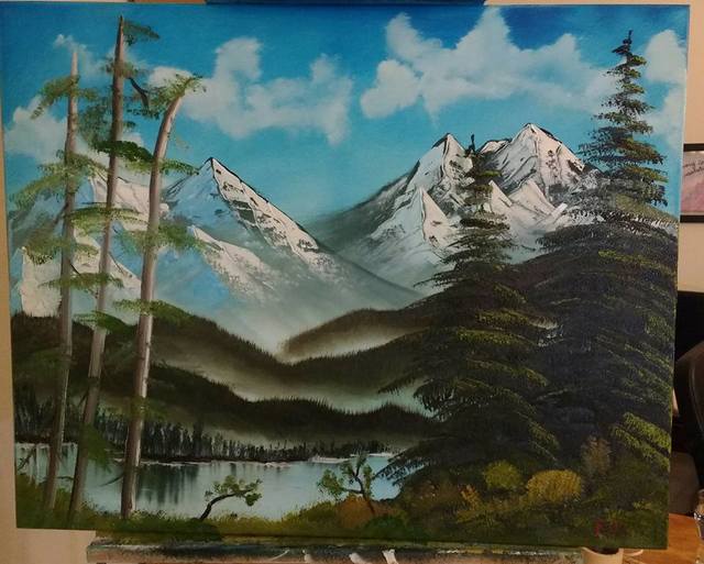 Painting of mountains and foothills and a lake and different kinds of trees