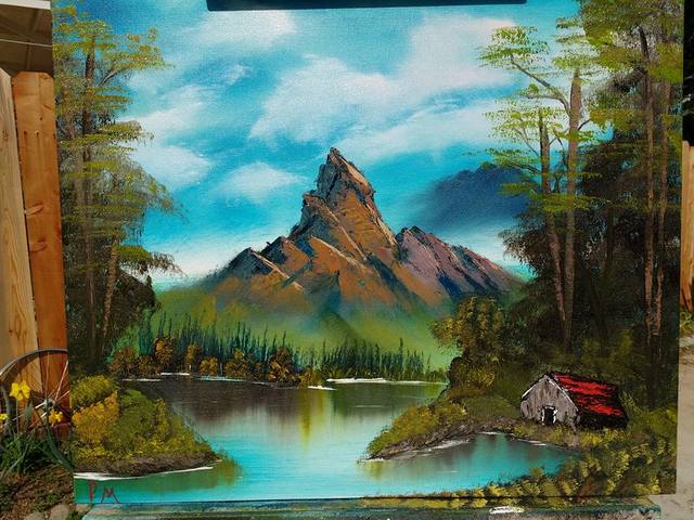 Painting of brown mountain with lake and barn in foreground.