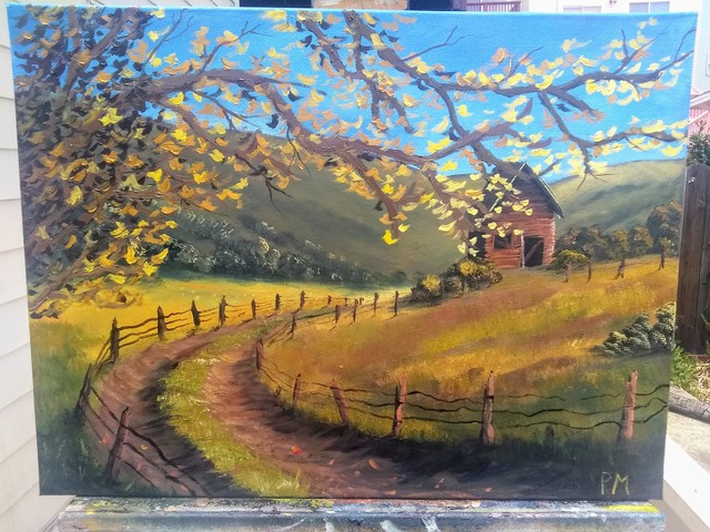 An picture of an old barn on a hill, with a dirt road leading up to it, with a tree, in autumn colours.